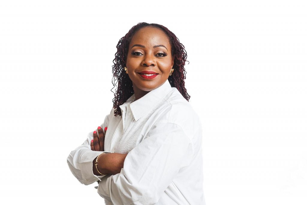 Image of the founder, she's wearing a white shirt